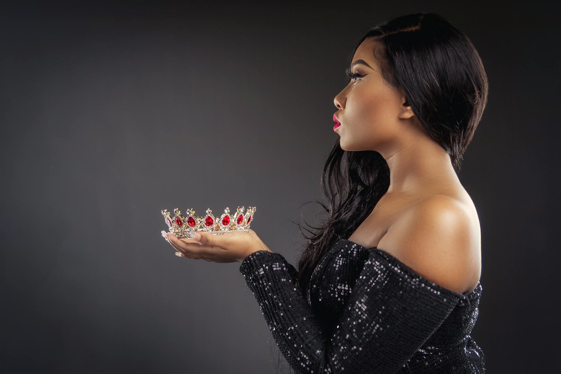 Photo Of Woman Holding Crown 