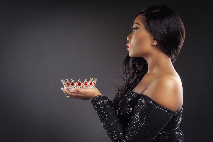 Photo Of Woman Holding Crown 