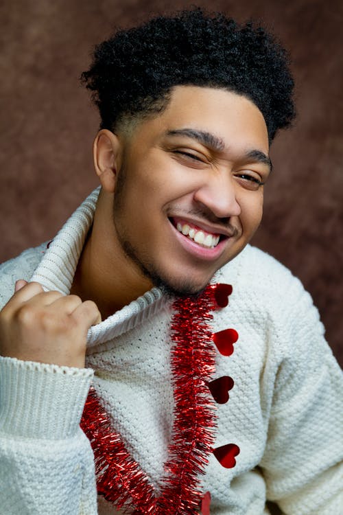 Smiling Man in White and Red Sweater