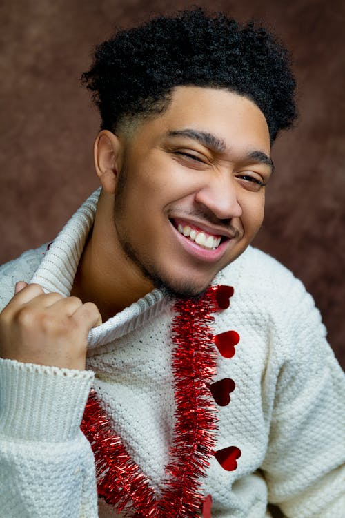 Free Smiling Man in White and Red Sweater Stock Photo