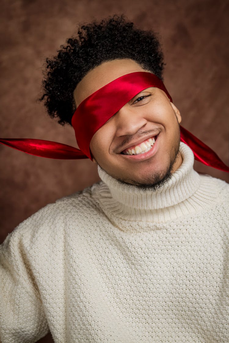 Smiling Man In White Turtleneck Sweater