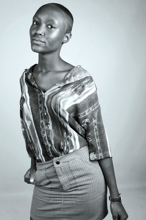 Free Elegant black and white portrait of a young woman showcasing fashion and style. Stock Photo