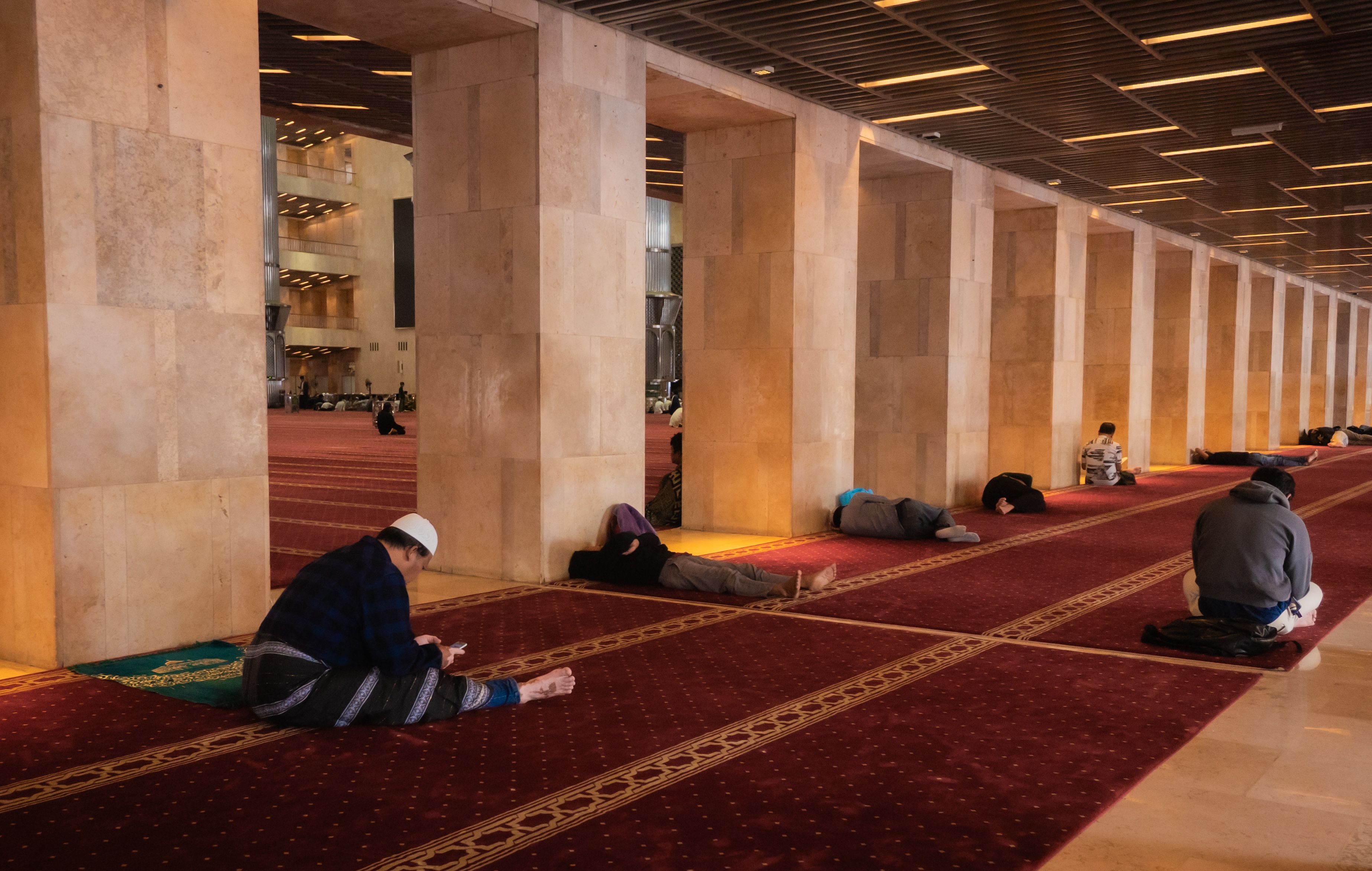 prayer mats on sidewalk