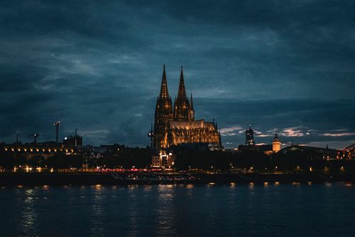 Free Stunning night view of Cologne Cathedral, reflecting over the Rhine River in Köln, Germany. Stock Photo