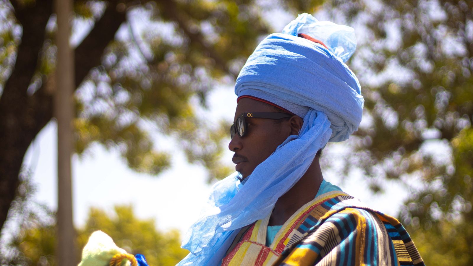 Portrait of a man in traditional nigerian attire outdoors, Guinea