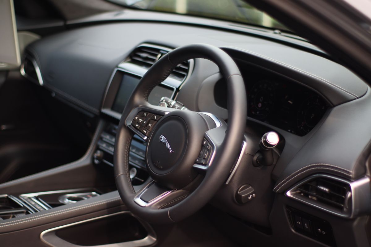 Interior of a luxury vehicle showing dashboard and premium finishes
