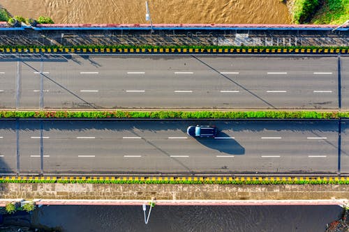 Free Aerial Photography of Car Moving on Highway Stock Photo