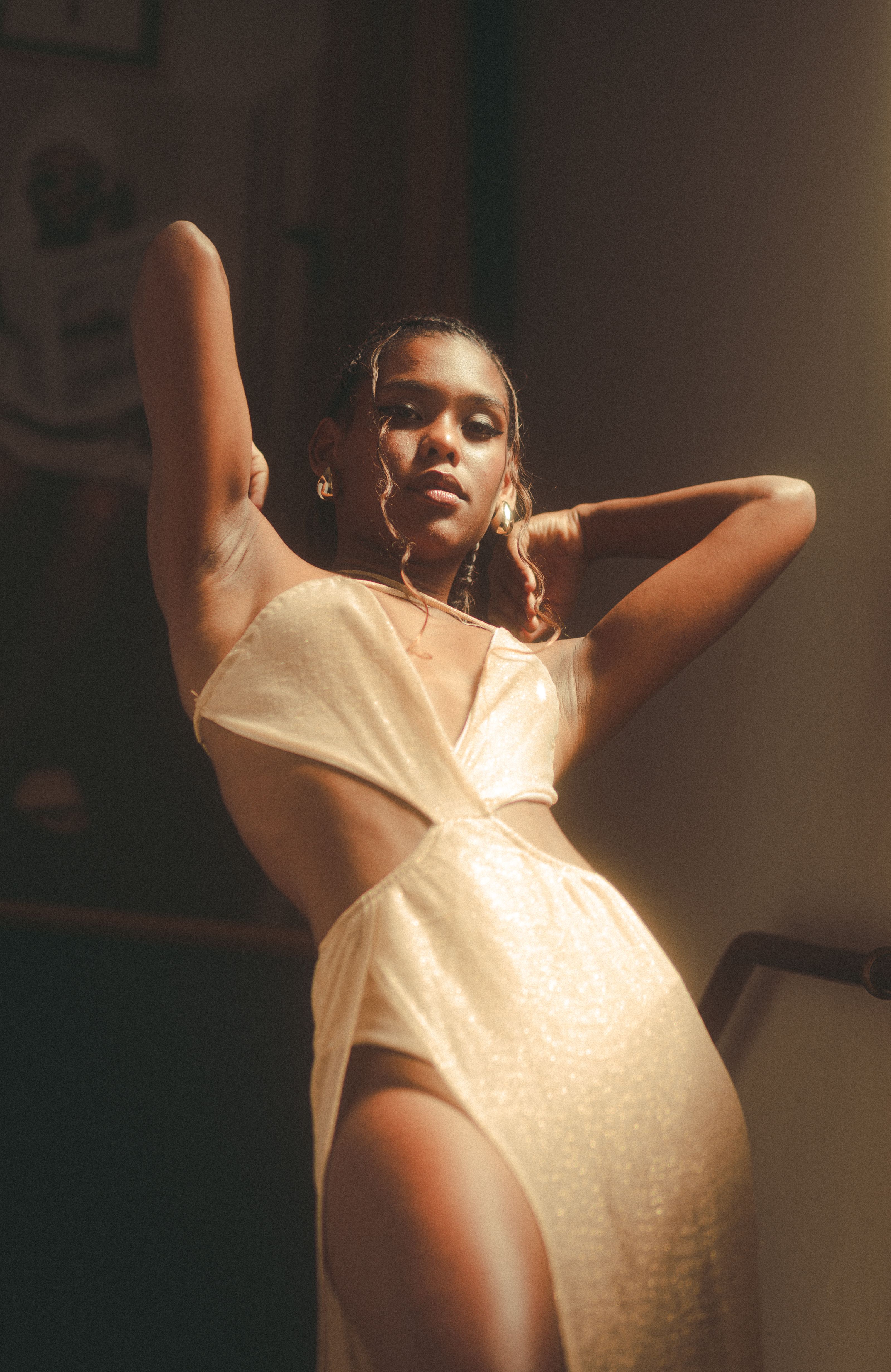 Woman in golden light wearing anti-tarnish jewellery