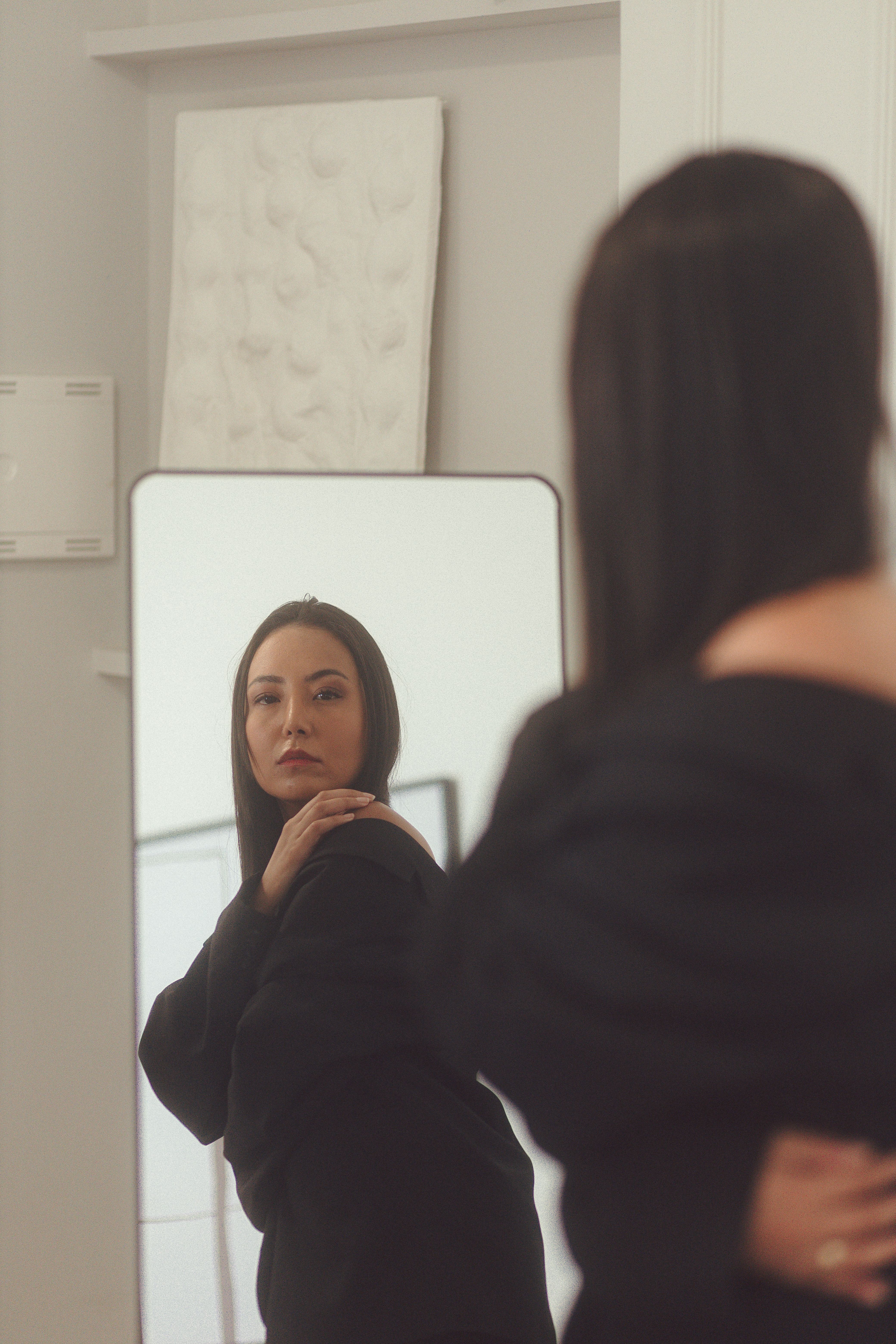 Woman Reflecting in Mirror in Stylish Setting · Free Stock Photo