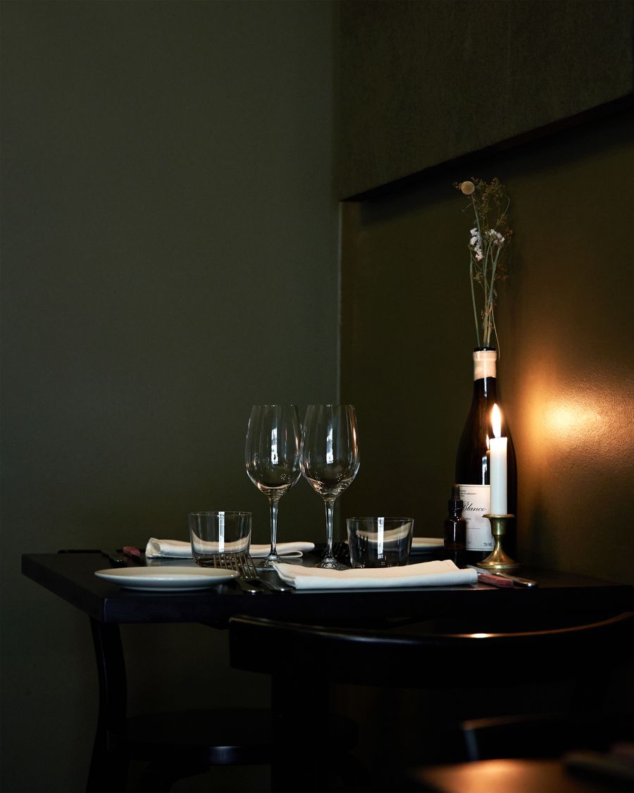 Candlelit table set with wine