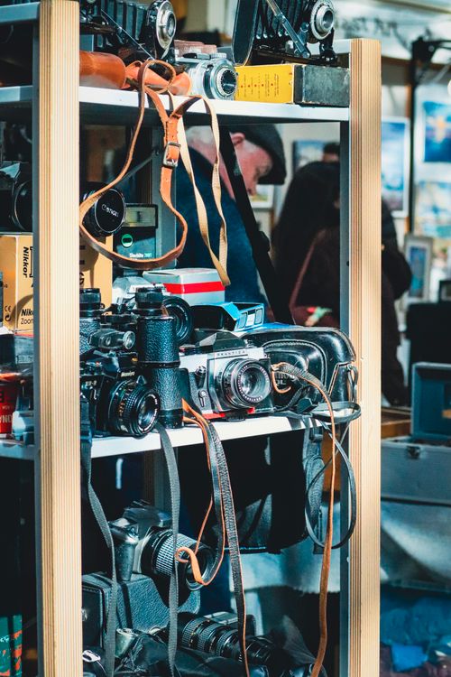 Free A collection of vintage cameras showcased on a shelf in an antique market setting, Northern Ireland. Stock Photo
