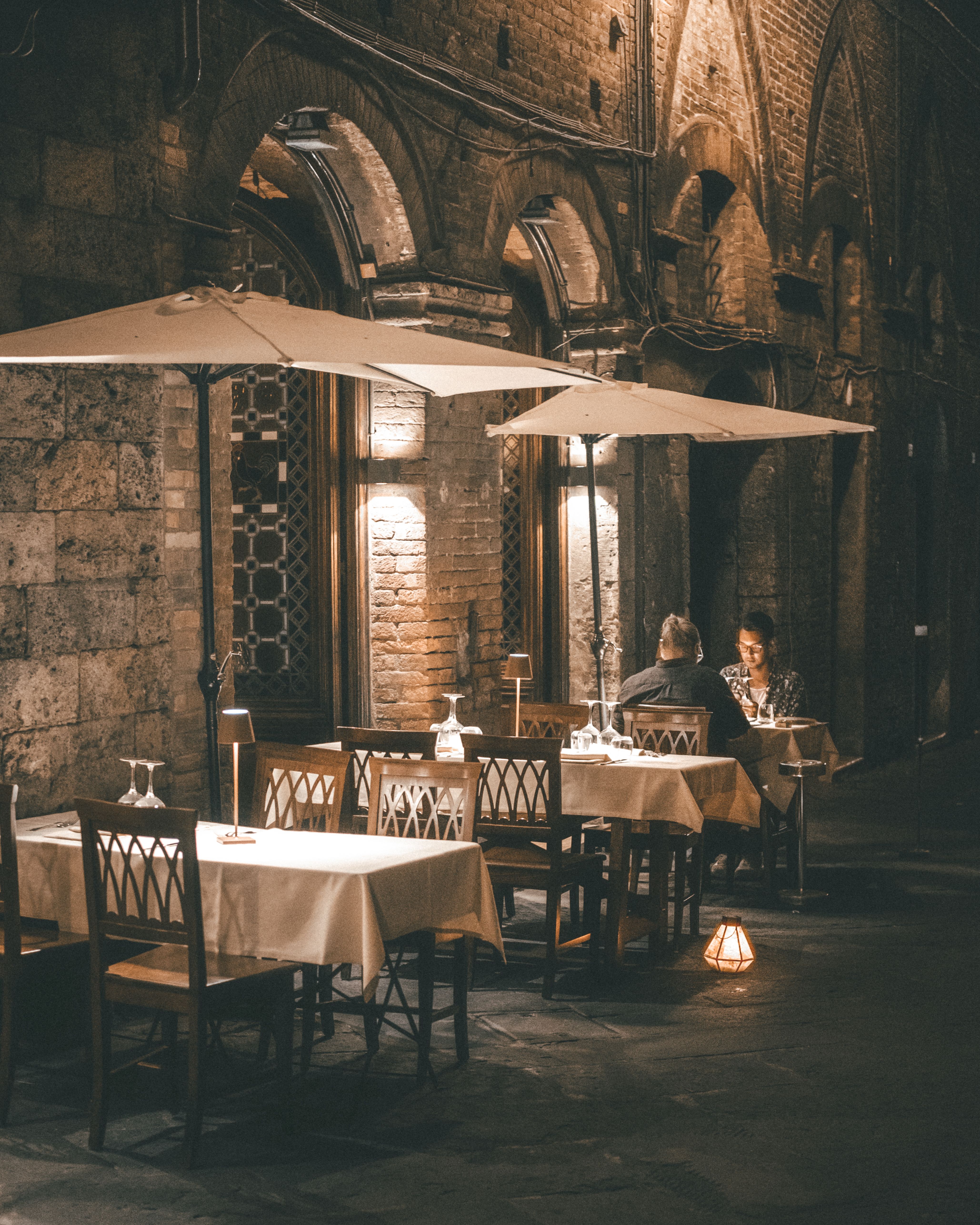 Romantic Outdoor Dining Scene in Historic Setting · Free Stock Photo