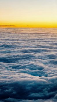 Captivating aerial photograph of sunset clouds with a vibrant, colorful sky above.