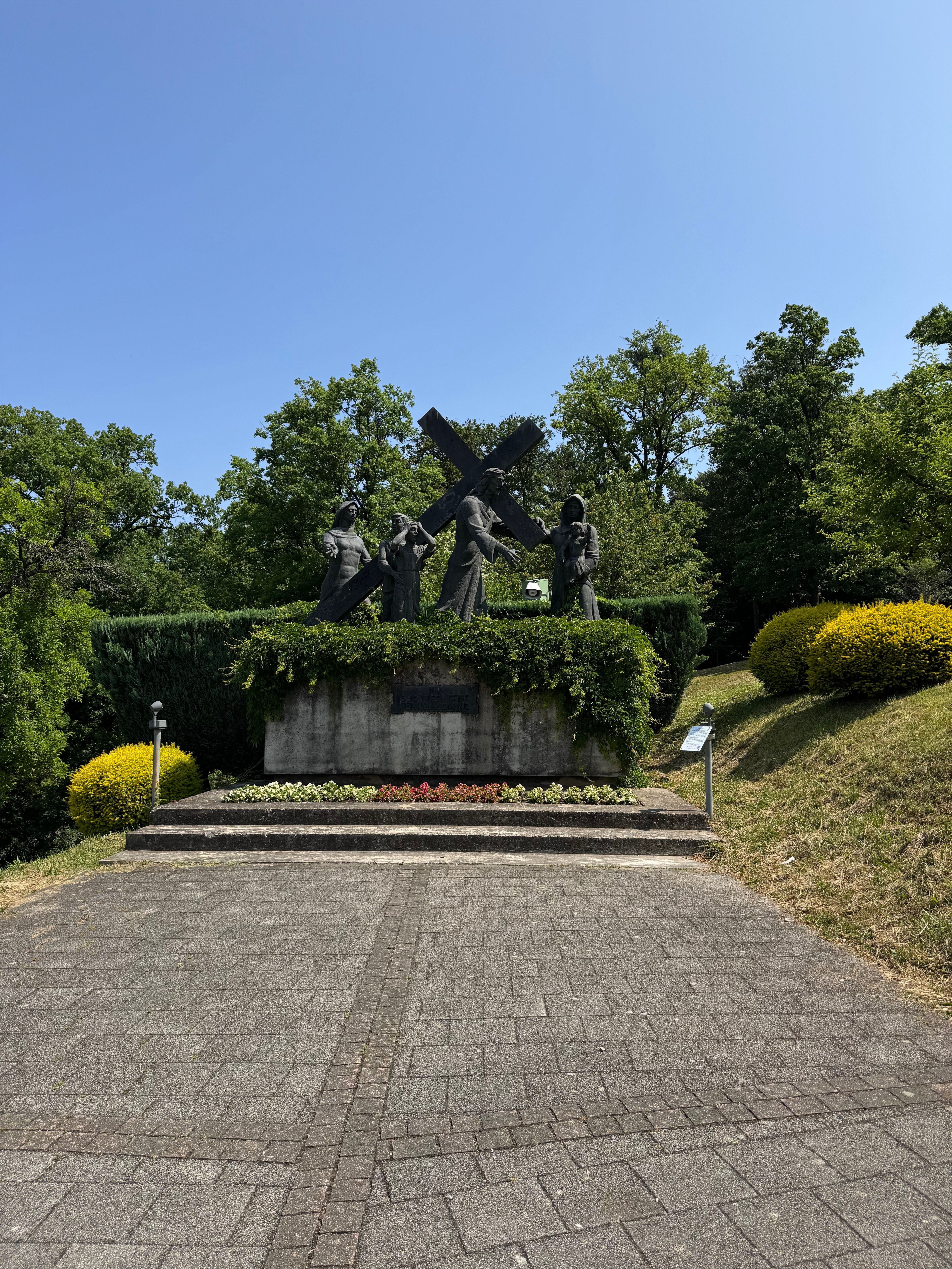 A historic sculpture depicting religious figures on a sunny day in Marija Bistrica, Croatia.