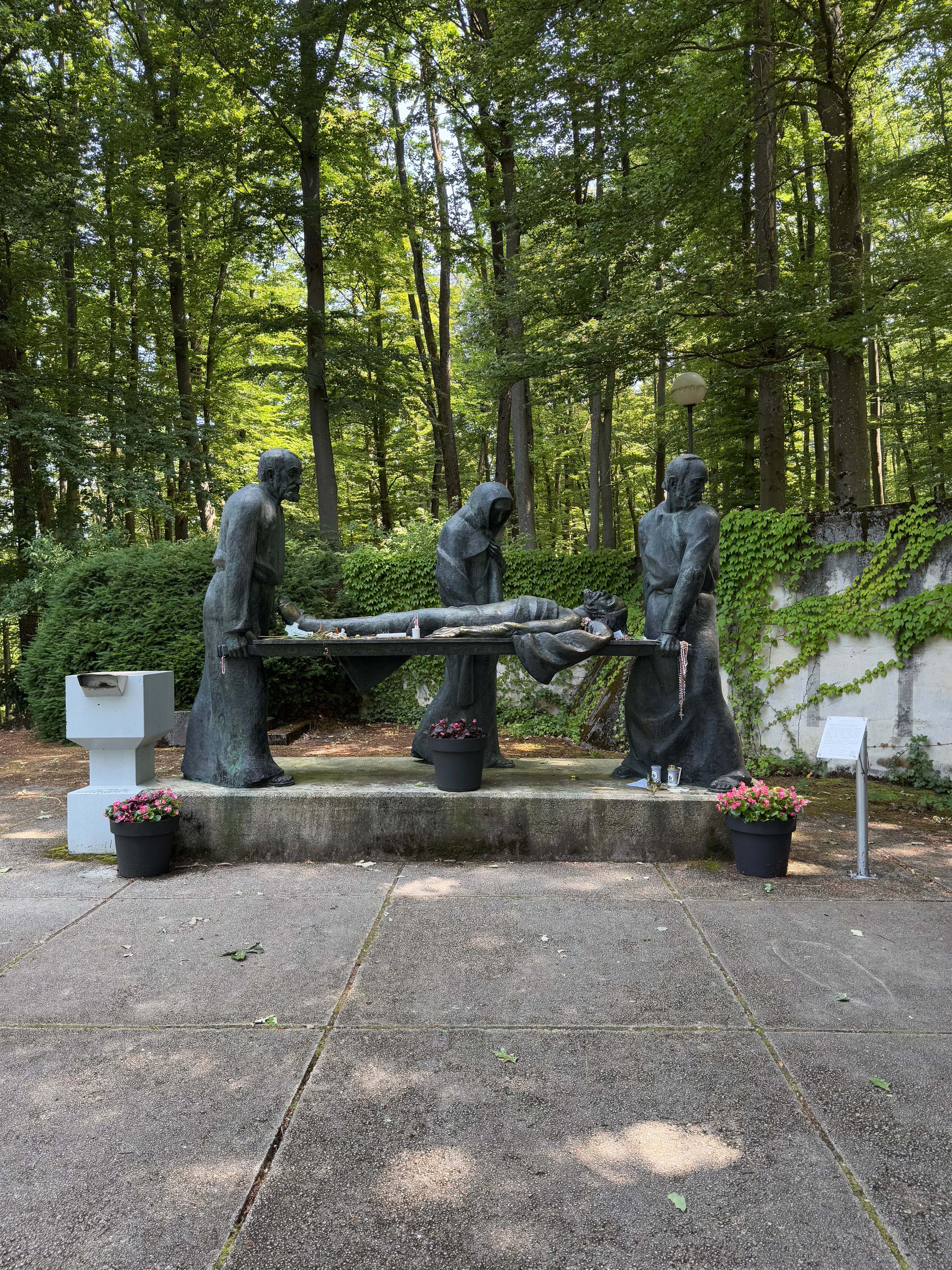 Outdoor sculpture of historical figures in a forested setting in Marija Bistrica, Croatia.