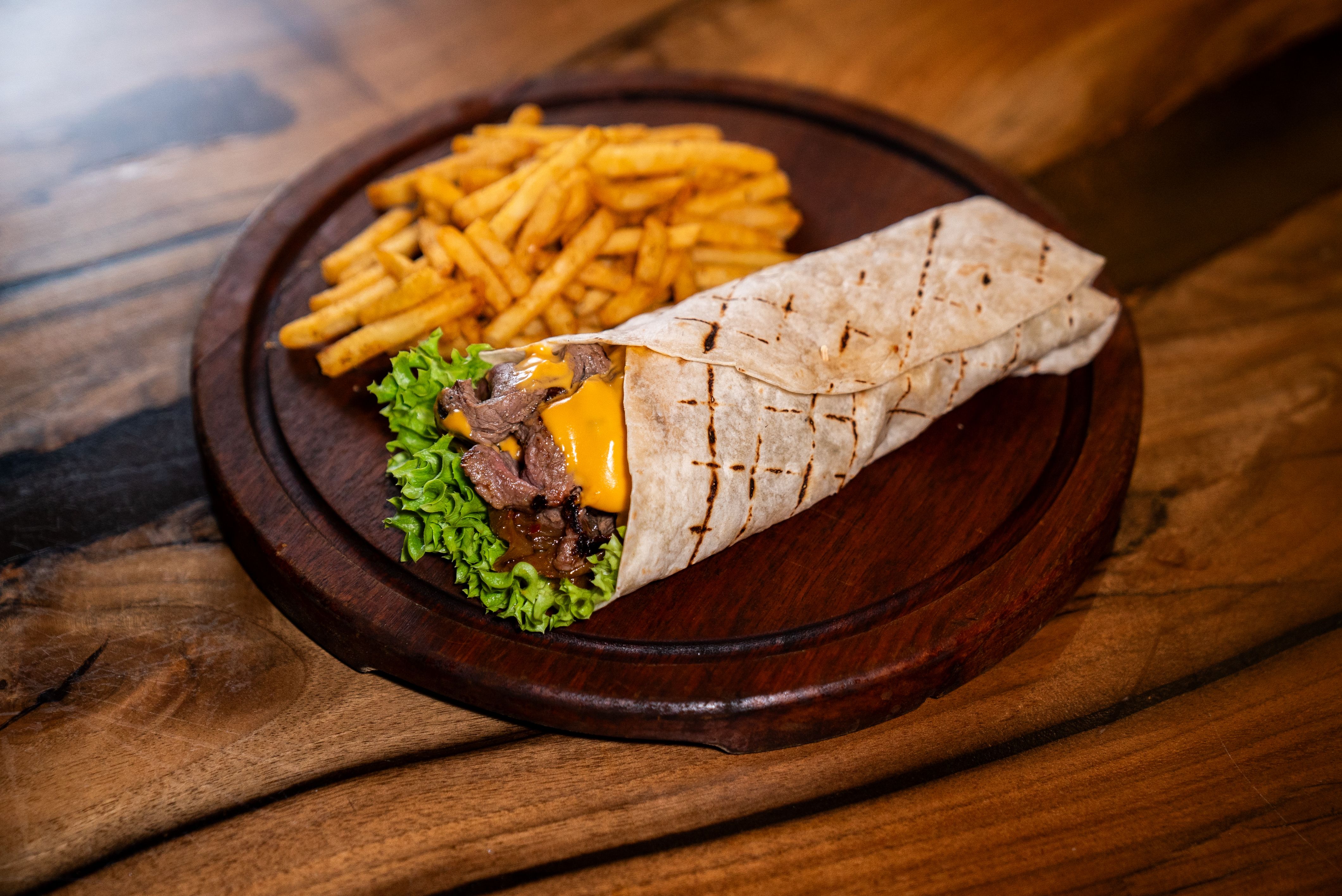 Braised Beef piada wrap with slow-cooked beef and arugula
