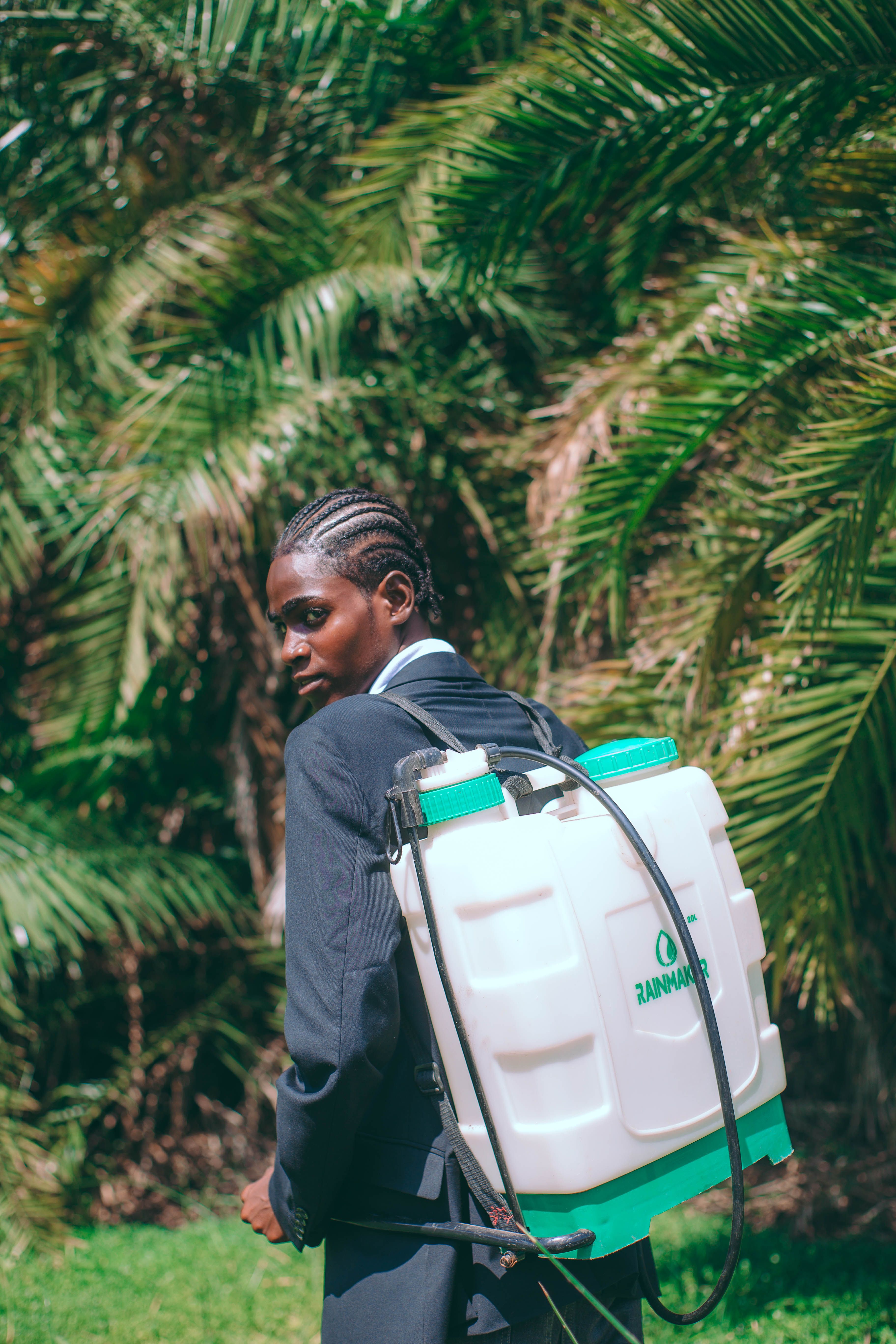 Portrait of a Man with Sprayer Outdoors · Free Stock Photo