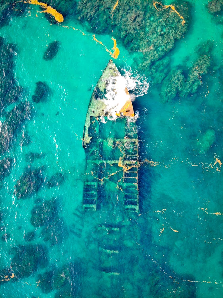 Aerial View Of A Ship Wreck On Body Of Water