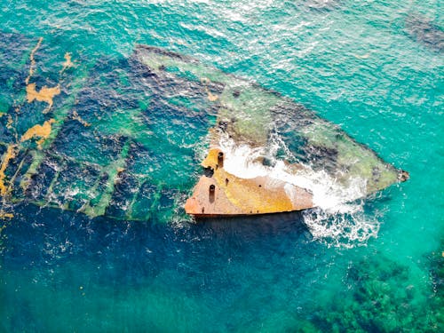 Aerial View of Shipwreck in the Middle of Ocean