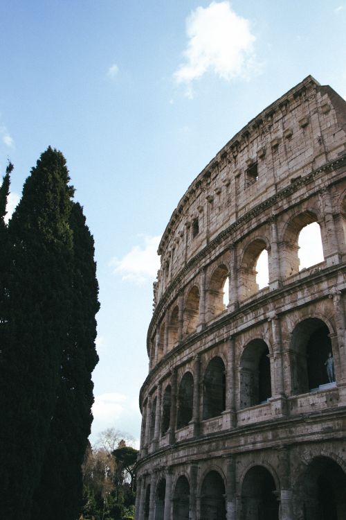 Colosseum in Rome under a Clear Blue Sky · Free Stock Photo