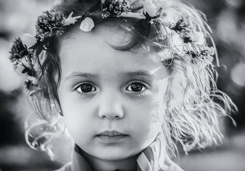 Free Photo Gray Scale of a Child With Floral Tiara Stock Photo