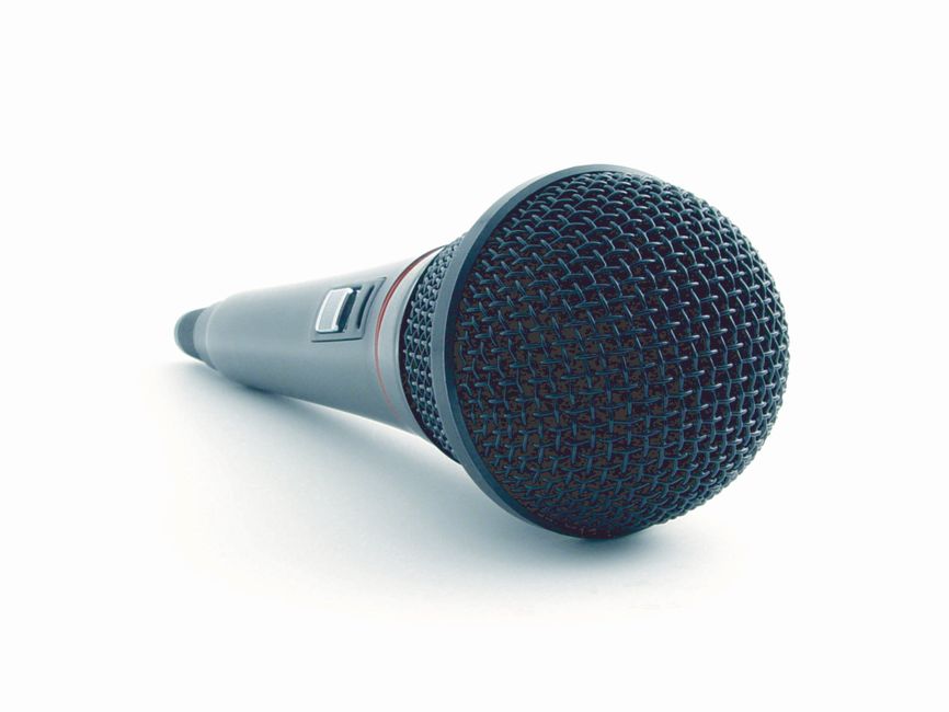 Close-up of a condenser microphone illustrating sound recording equipment in a studio setting.
