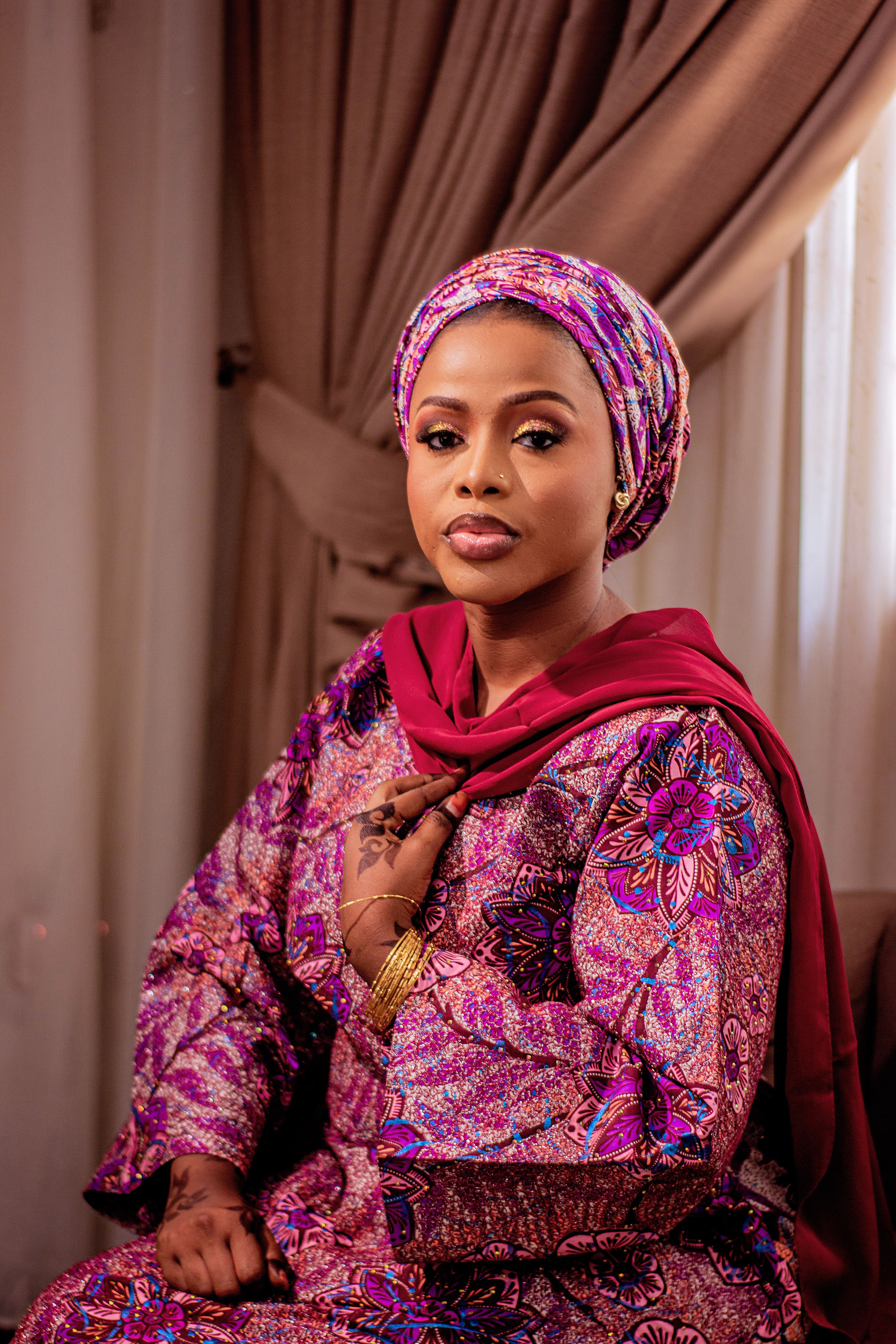 Elegant Woman in Traditional African Attire Indoors · Free Stock Photo