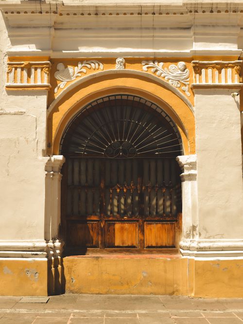 Free Elegant archway with intricate design in Toluca, Mexico. Bright sunlight enhances textures. Stock Photo