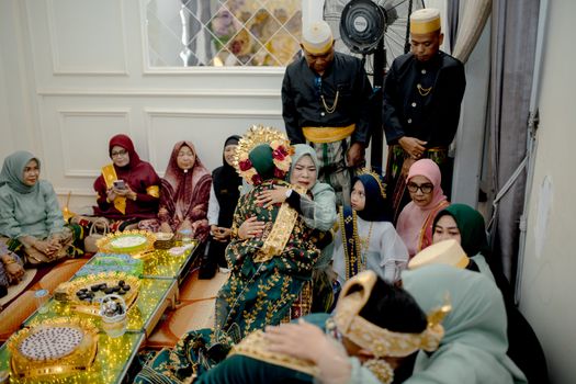A traditional gathering in South East Sulawesi featuring cultural attire and ceremonial activities.