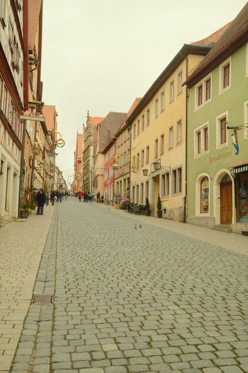 Free Picturesque old town street in Rothenburg ob der Tauber, Germany, with colorful historical buildings. Stock Photo