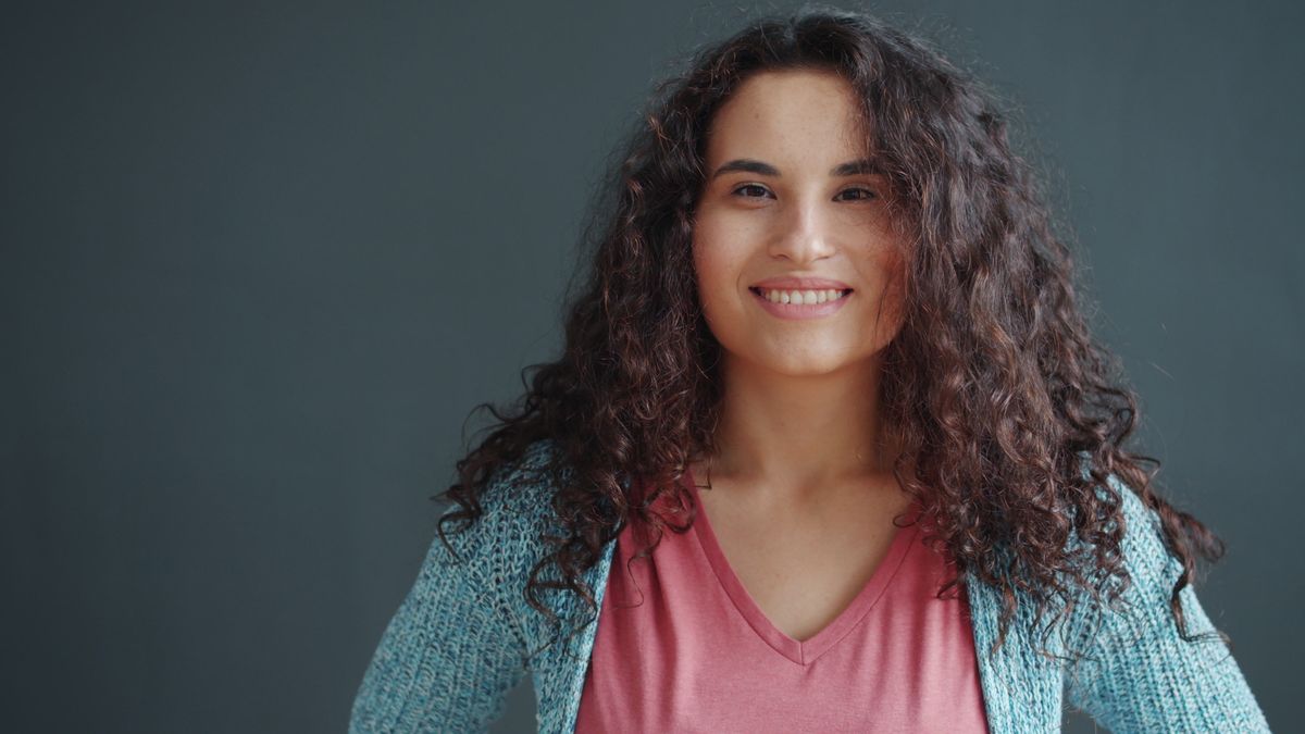Portrait Photo of Smiling Woman with Brown Curly Hair · Free Stock Photo