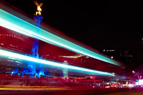 Free Dynamic long-exposure shot of the Angel of Independence in Mexico City, capturing vibrant light trails. Stock Photo
