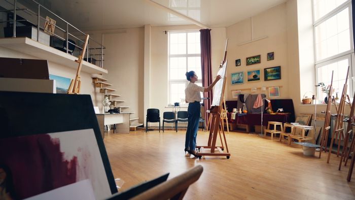 Artist painting on canvas