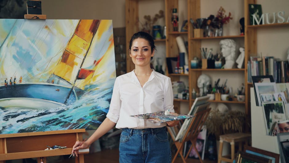Canva vs Adobe Express: YouTube Thumbnail Text Overlay Showdown (2024) Female artist in studio smiling in front of her vibrant sailboat painting, holding a palette.