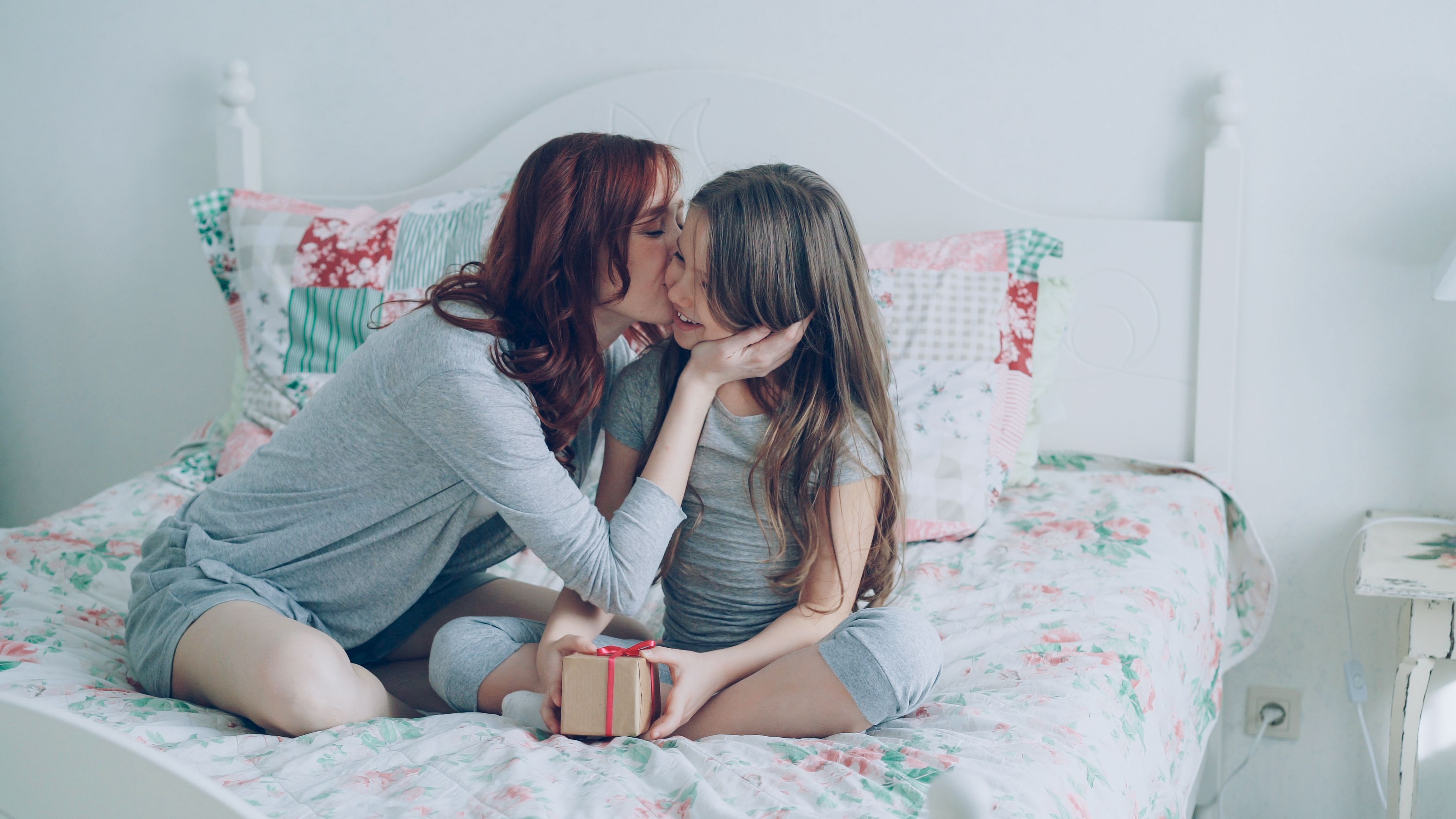 A loving mother and daughter sharing a warm moment together