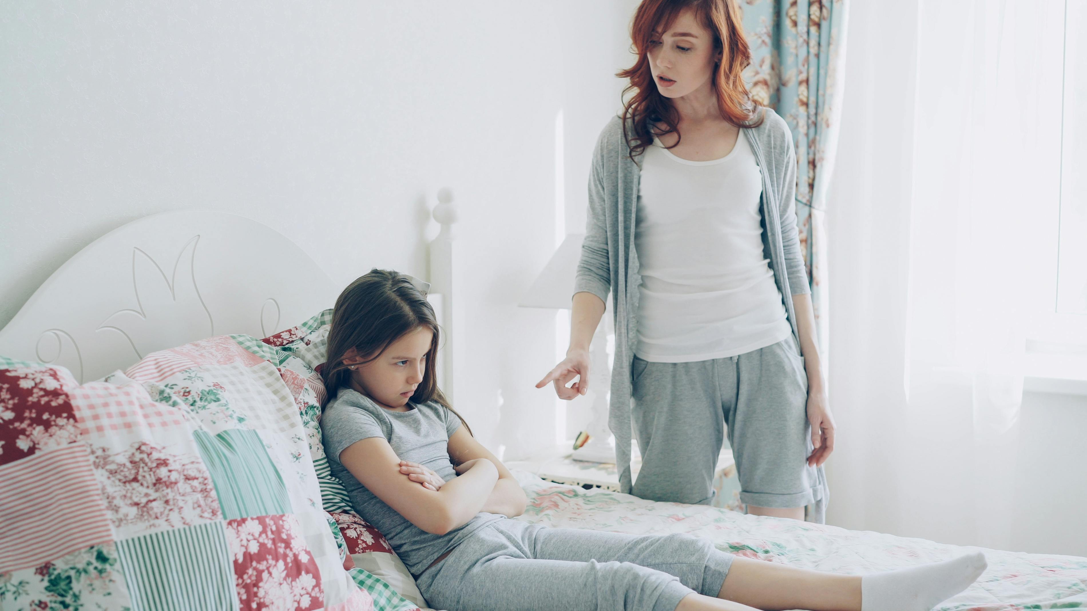 Mother and daughter in a tense conversation, highlighting family dynamics.