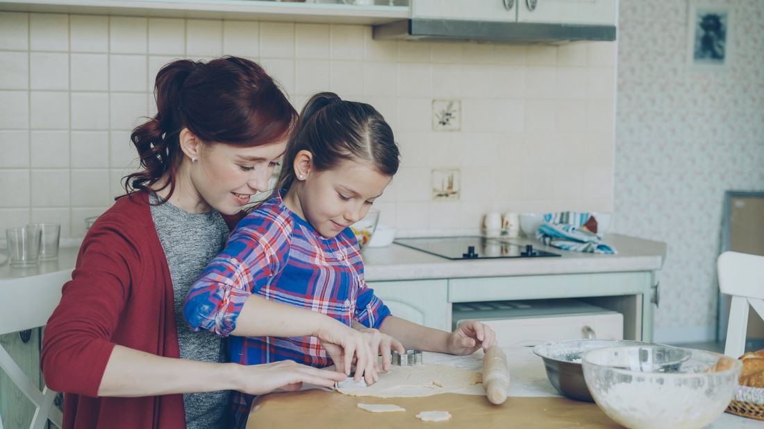 A parent and child baking together at a kitchen counter — photo by Vitaly Gariev on Pexels
