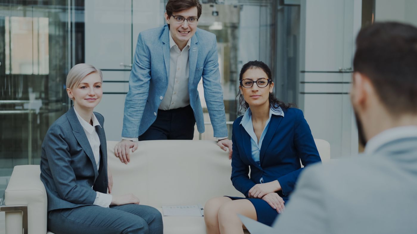 Professional advisory team in a client discussion