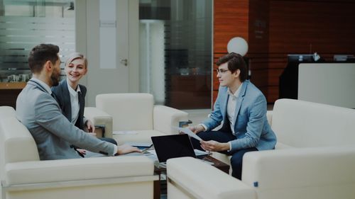 Free Group of professionals having a productive business meeting in a modern office setting. Stock Photo