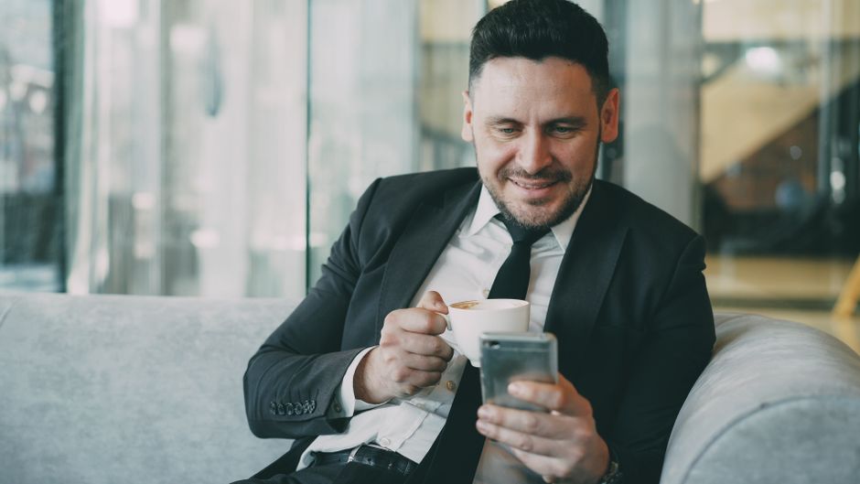 full|person reading news on smartphone