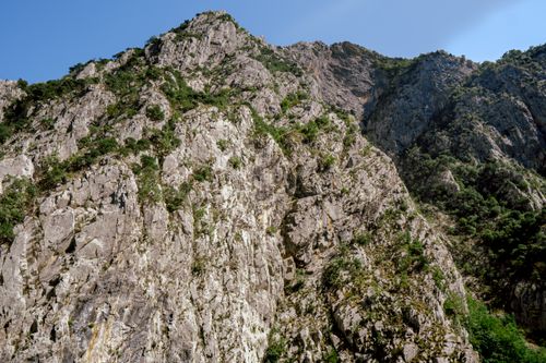 Free Explore the stunning rocky cliffs of Koman, Shkodër County, Albania, under a clear blue sky. Stock Photo