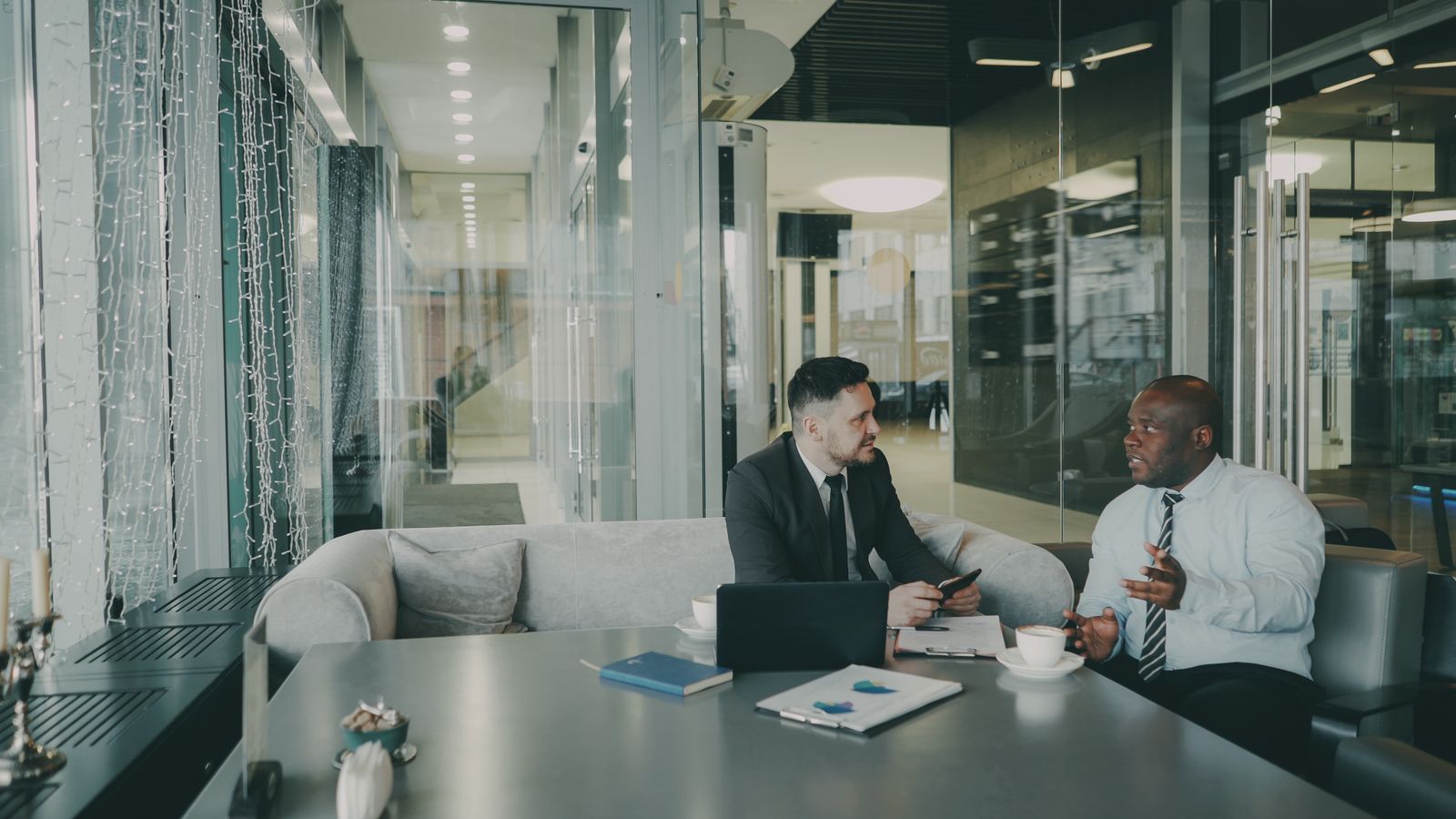 Diverse team collaborating in a modern office meeting
