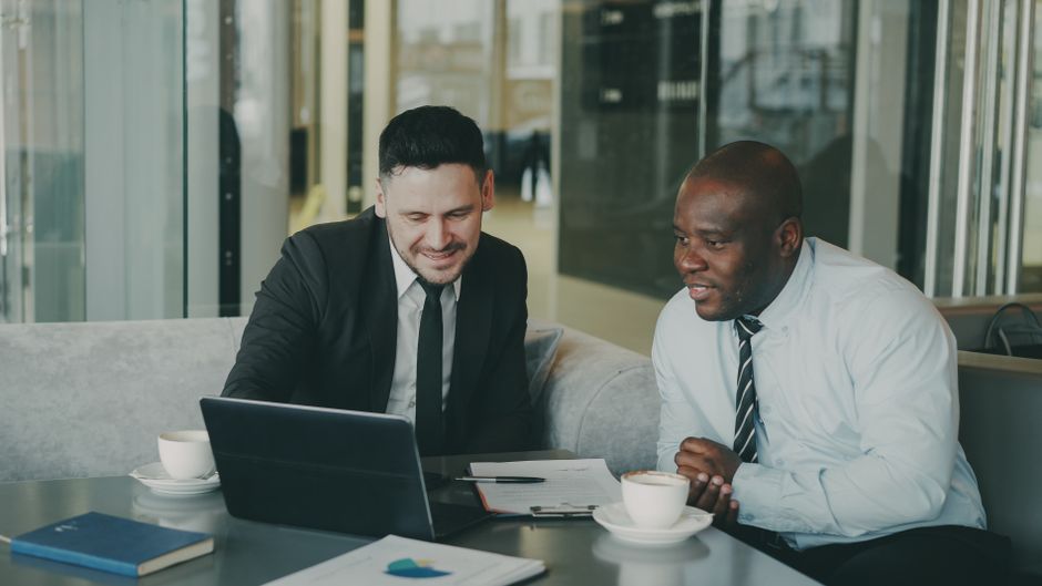 two people discussing marketing strategy office