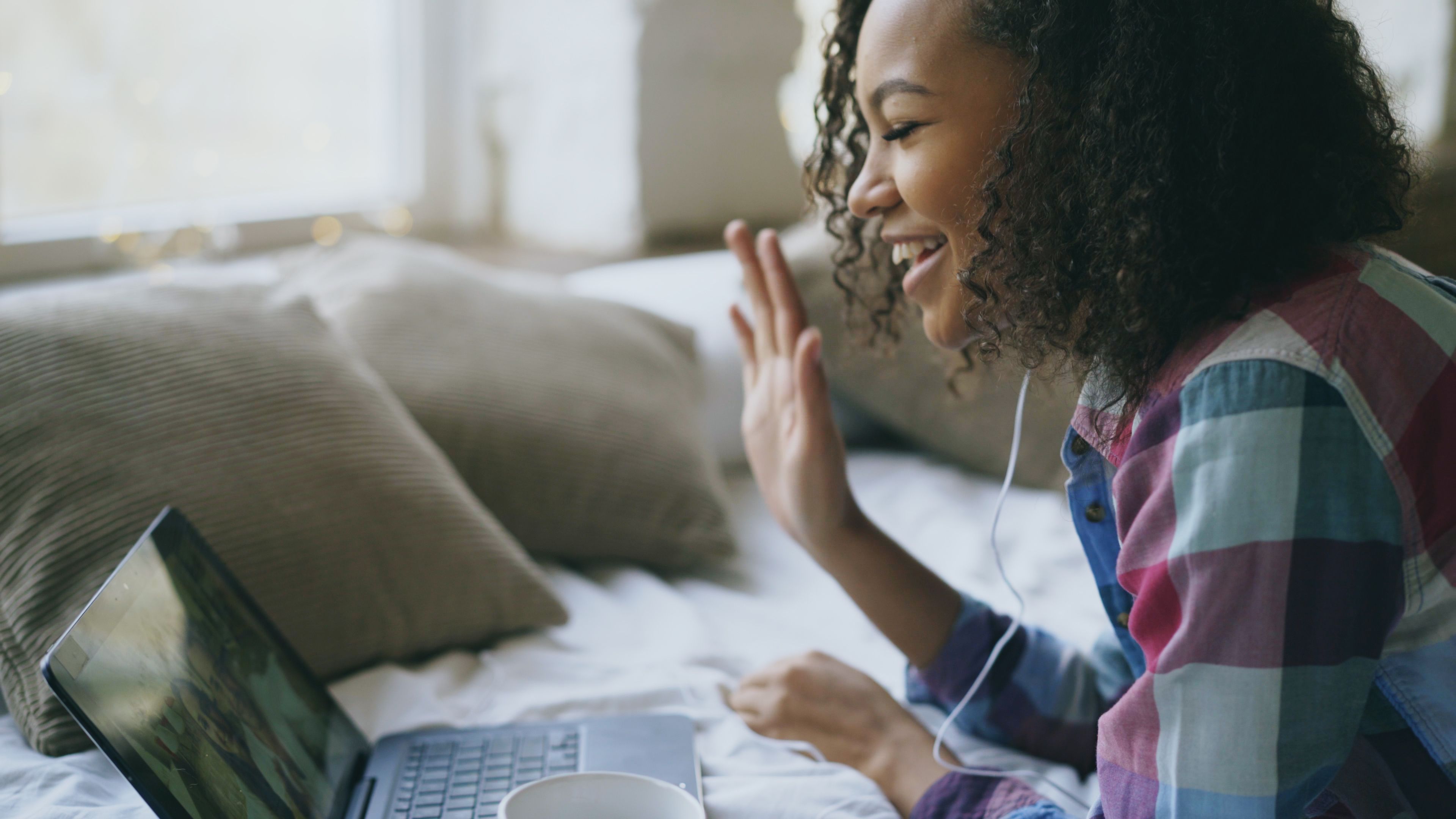 Smiling Woman Video Calling on Laptop · Free Stock Photo