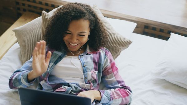 Woman on video call laptop at home — virtual therapy article