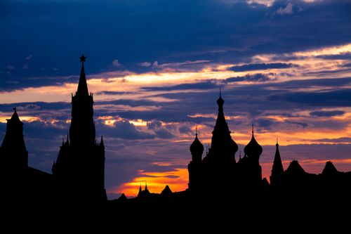 Free Stunning silhouette of the Kremlin towers against a vibrant sunset sky in Moscow, Russia. Stock Photo