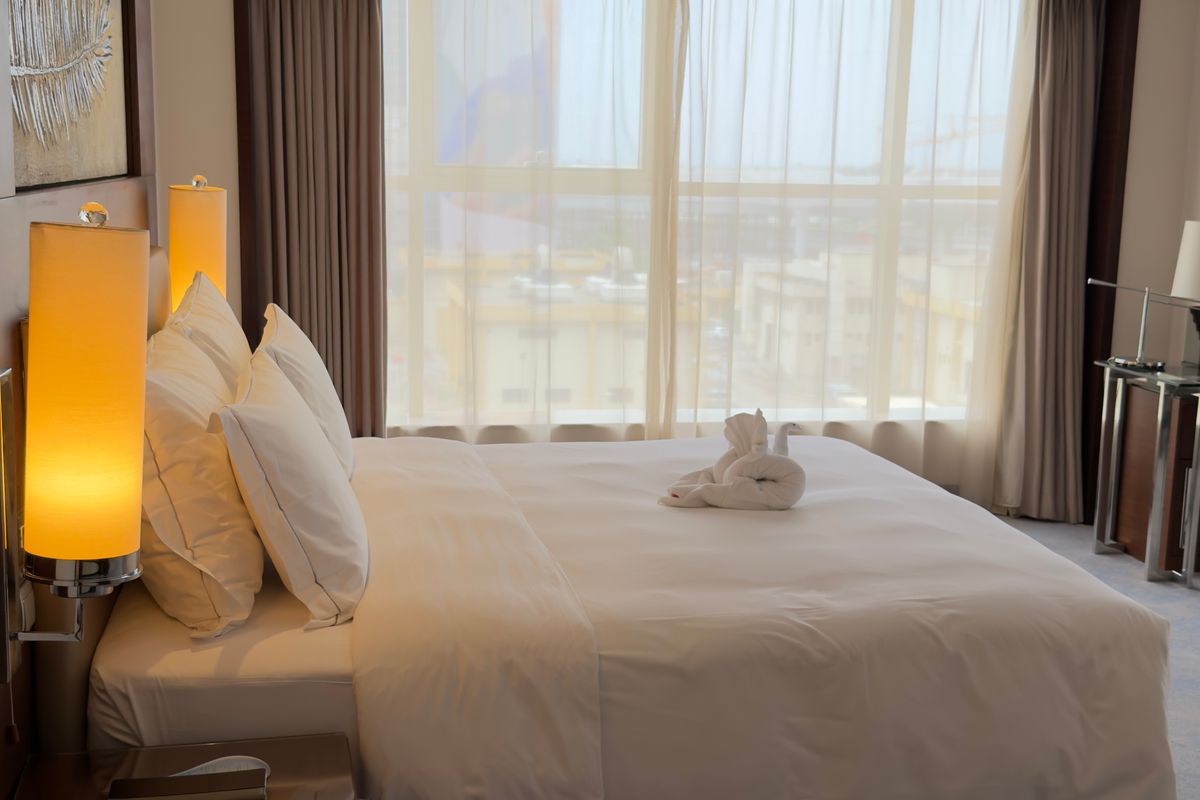 Hotel room with a large window and daylight