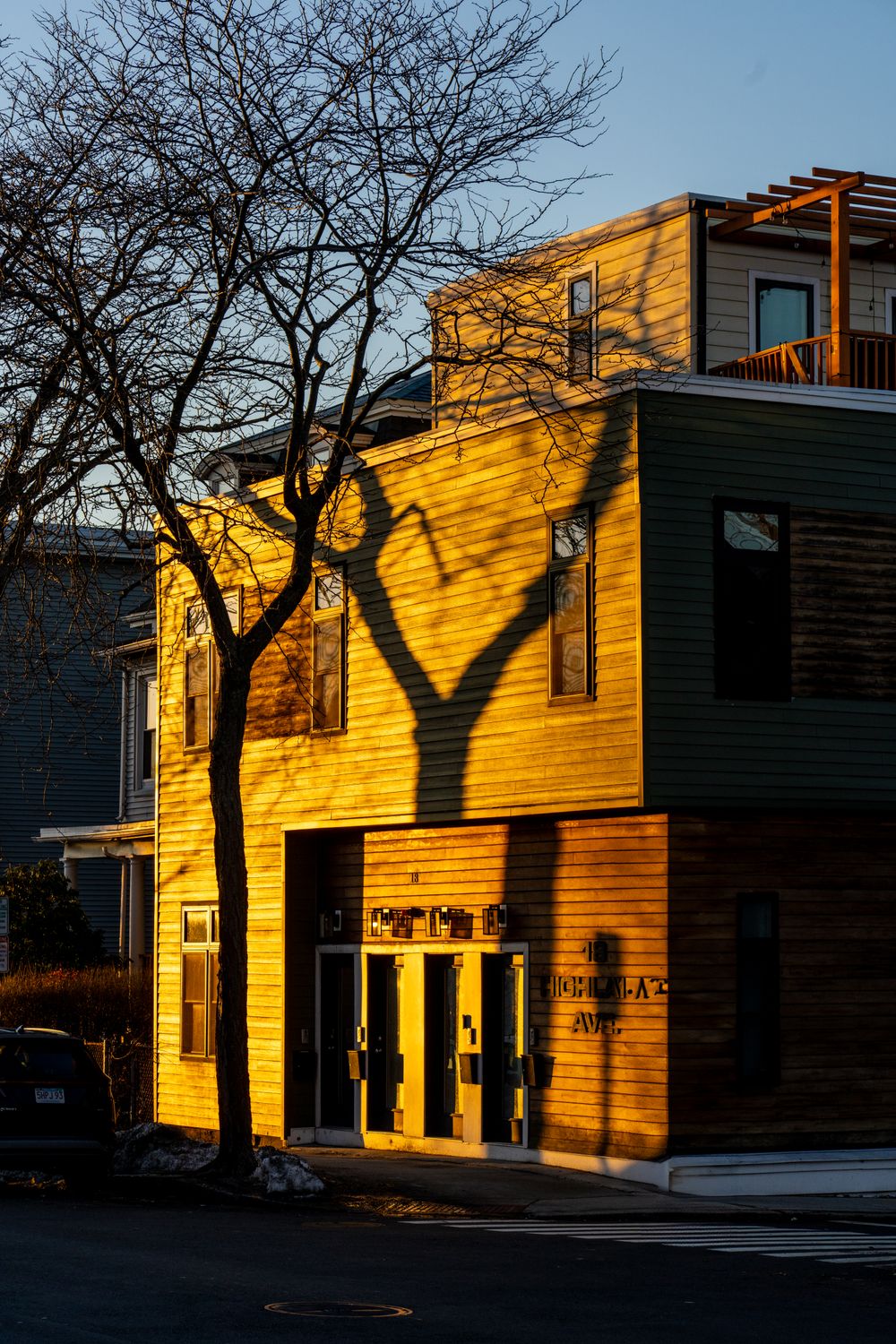 Golden Hour Shadows on Modern Building · Free Stock Photo