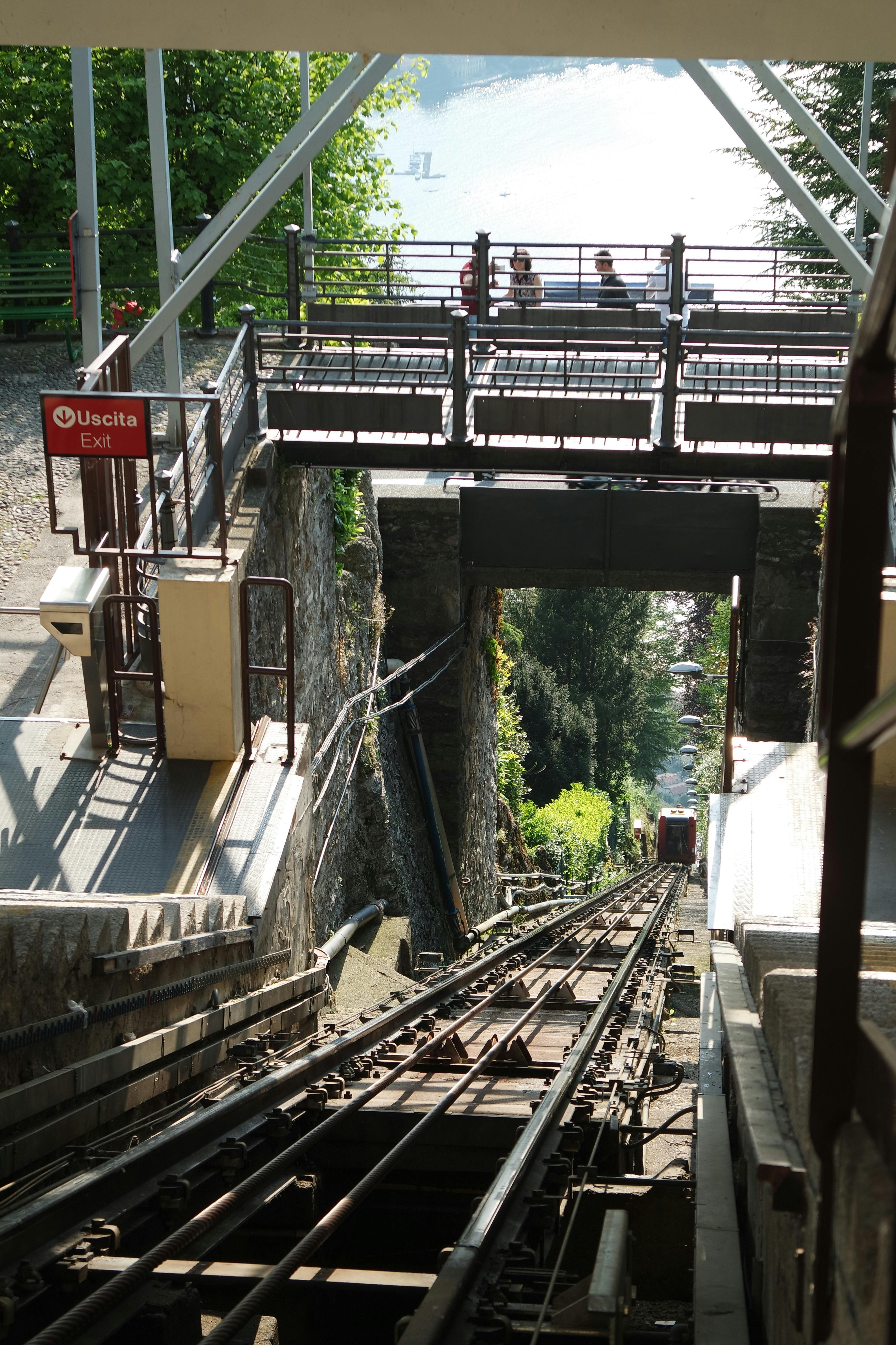 The Como–Brunate funicular railway climbing the steep hillside above Lake Como, offering passengers spectacular panoramic views of the lake, mountains, and the city of Como during the seven-minute ride