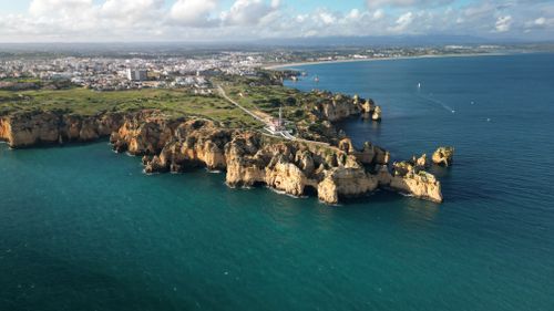 Free A breathtaking aerial view of the scenic Algarve cliffs and coastline in Portugal. Stock Photo